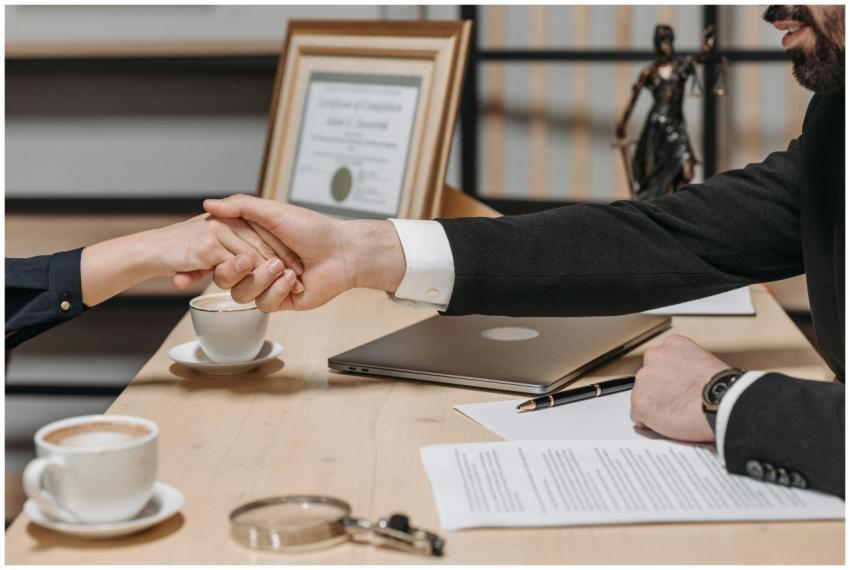 A formal handshake over a business contract in a c