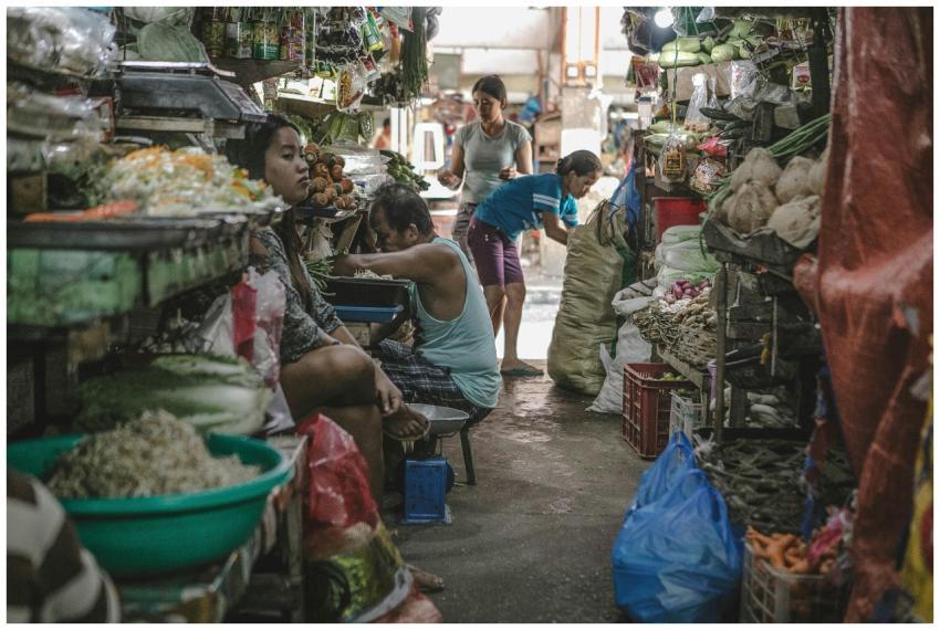 A vibrant local market scene with vendors selling