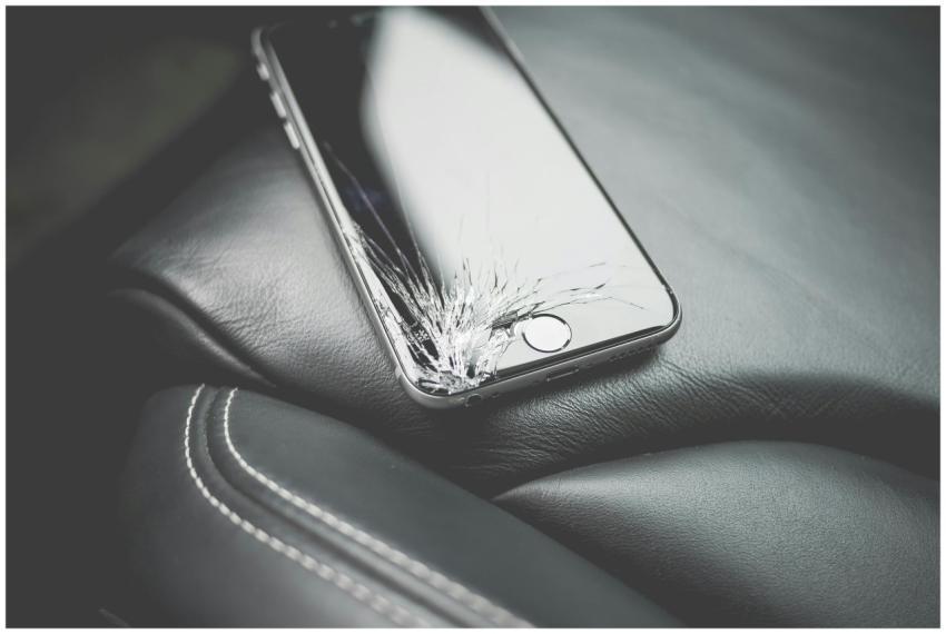 Close-up of a broken smartphone with a cracked scr