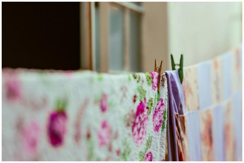 Close-up view of floral and patterned laundry hang