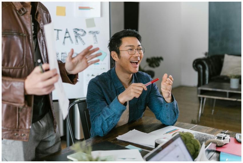 Engaged team members in a lively office meeting di