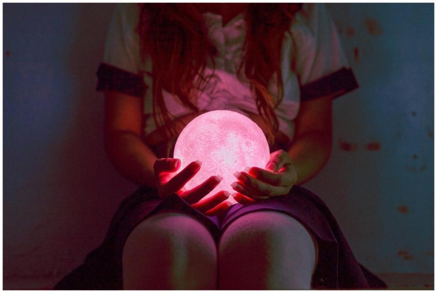 A captivating image of a woman holding a glowing p