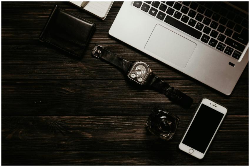 Minimalist flat lay of a laptop, smartphone, and a