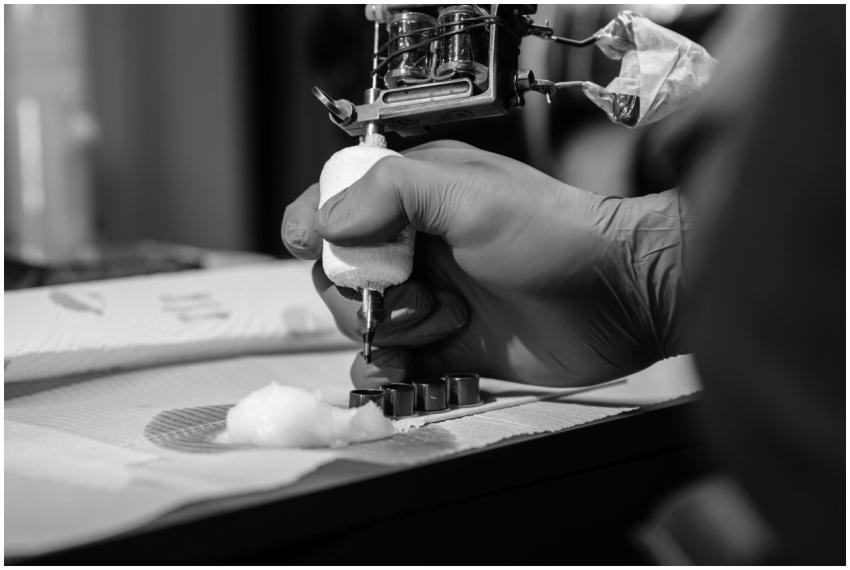 Detailed black and white close-up of a tattoo arti