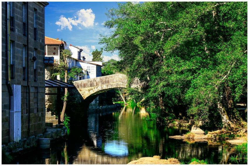 Beautiful stone bridge in Allariz, Spain, reflecti