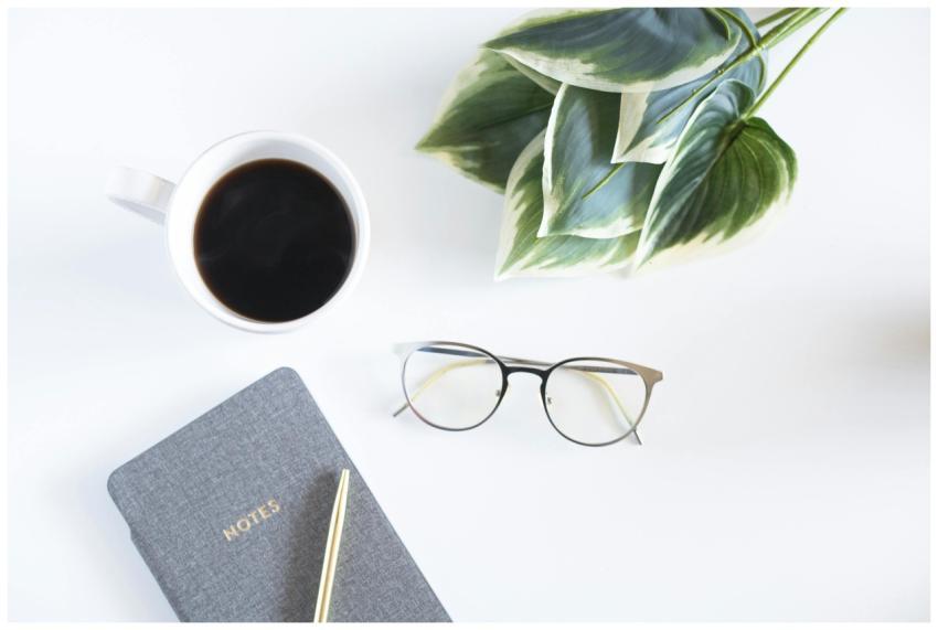 A minimalist workspace featuring a coffee cup, not