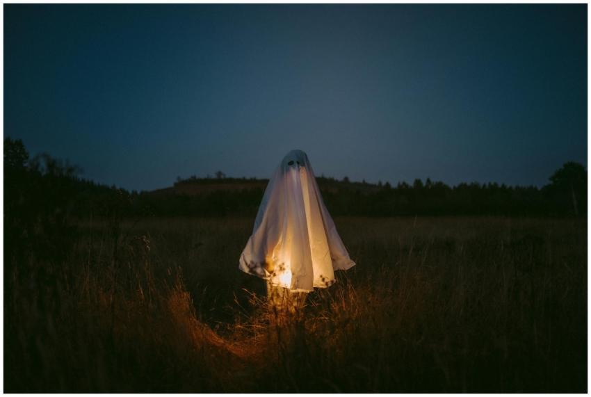 A ghostly figure illuminated in a dark field captu