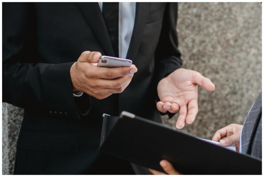 Close-up of business professionals discussing deal