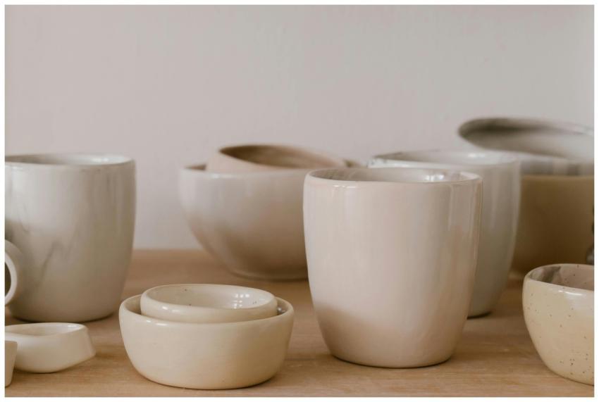 A collection of handcrafted ceramic bowls and cups