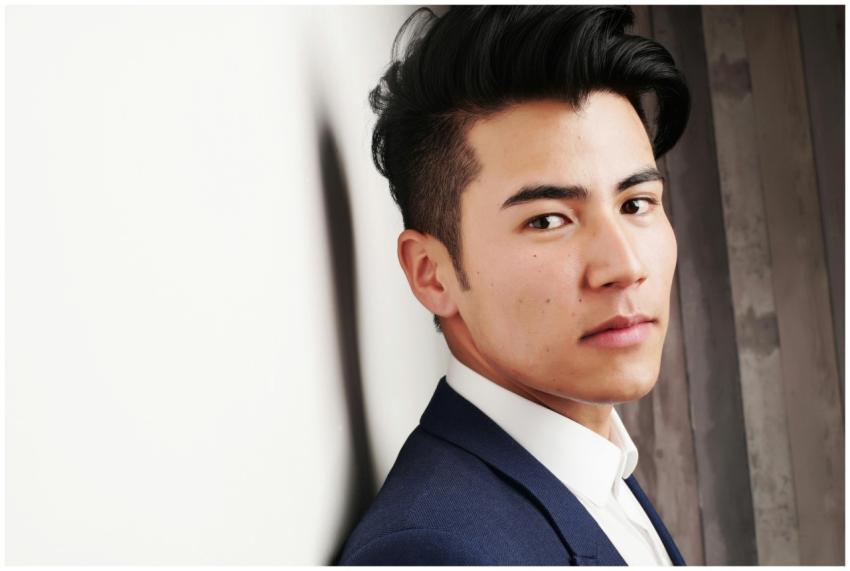 Close-up portrait of a serious Asian man in a form