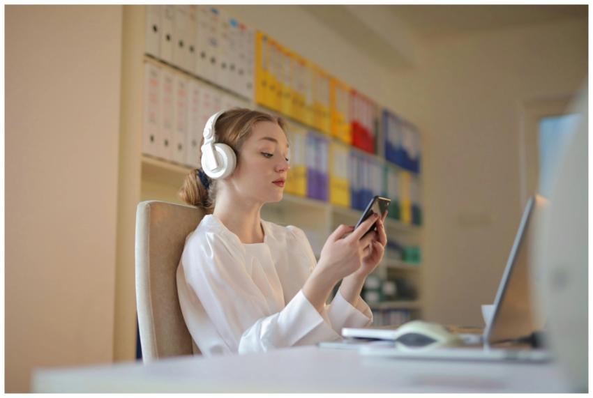 Young woman in white shirt using smartphone and he