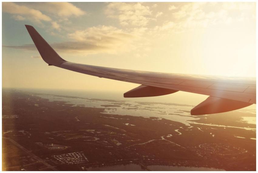 Stunning aerial view of a plane wing flying over F