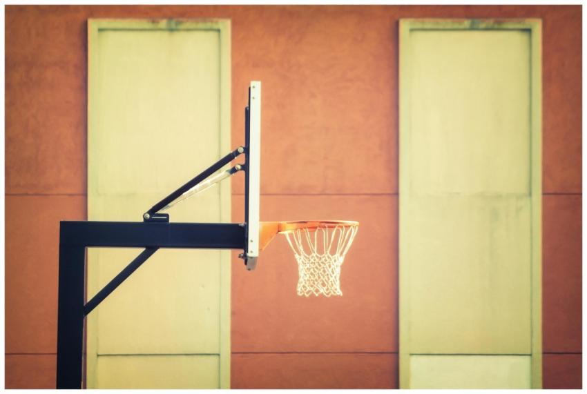 Stylish indoor basketball hoop with net against a