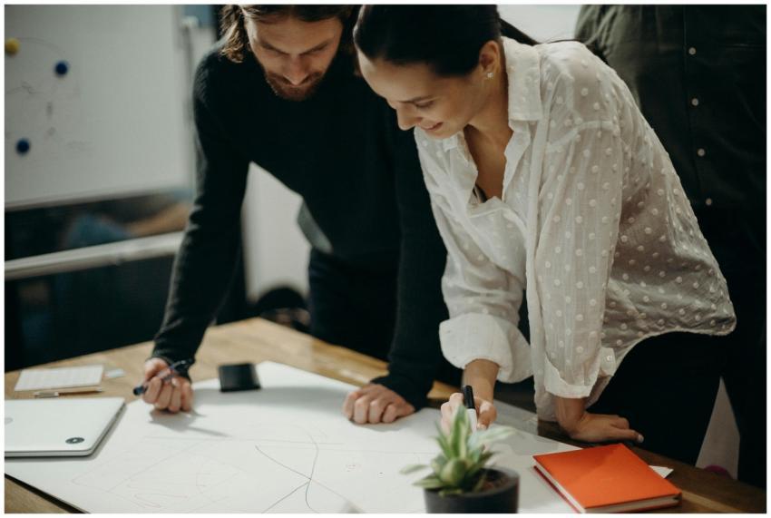 Two colleagues engage in a creative brainstorming