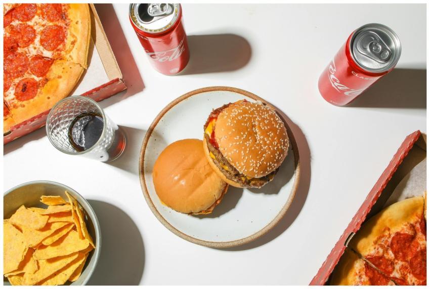 An appetizing fast food spread featuring pizza, bu