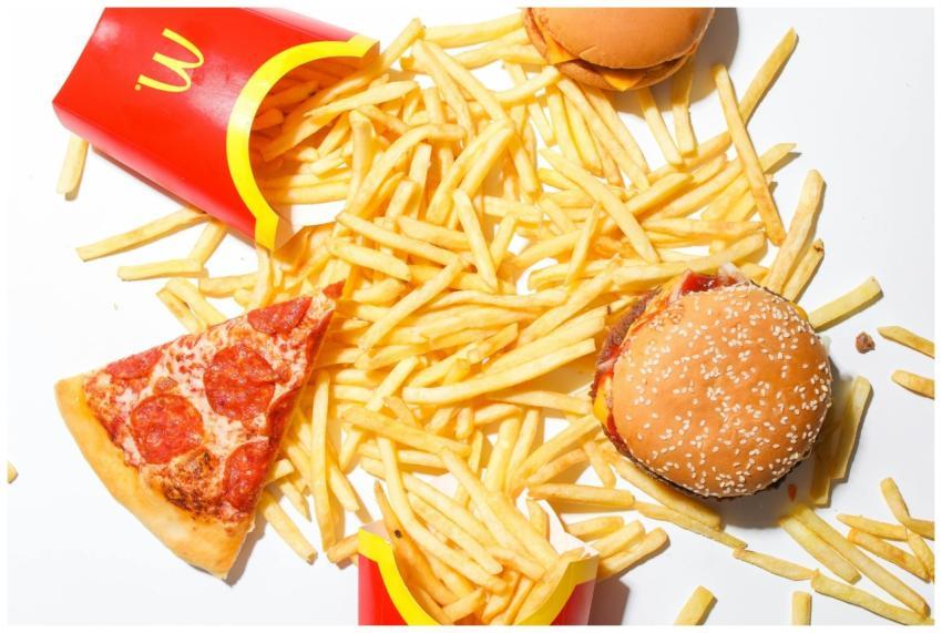 A tantalizing spread of burger, fries, and pizza s