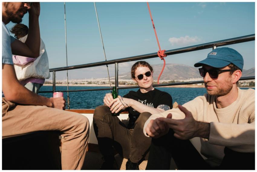 A group of friends relaxes on a boat under the war