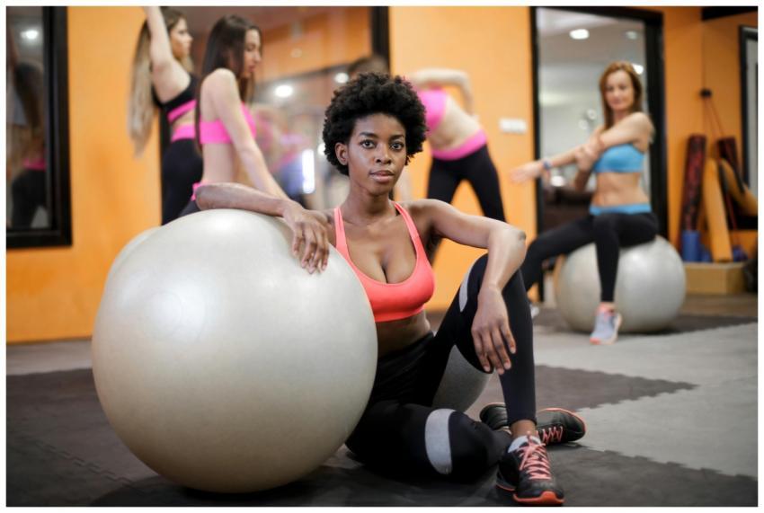 Group of women exercising with fitness balls in a