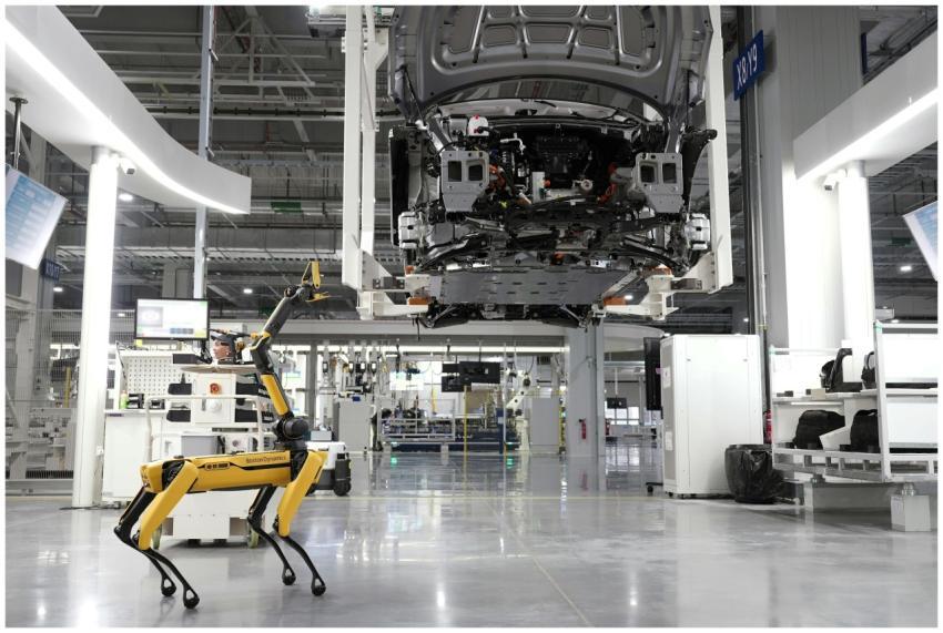 A robotic dog oversees an automated car assembly i