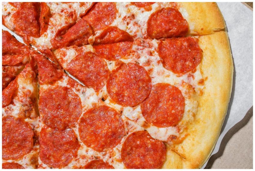 Mouthwatering close-up of pepperoni pizza slices w