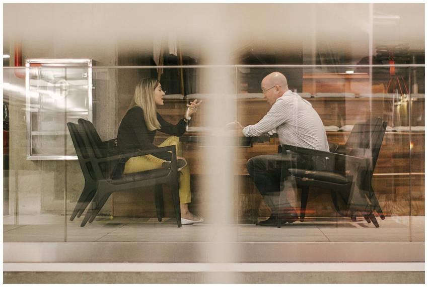 Two professionals engaged in a discussion in a mod