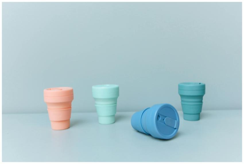 A set of pastel-colored collapsible cups promoting