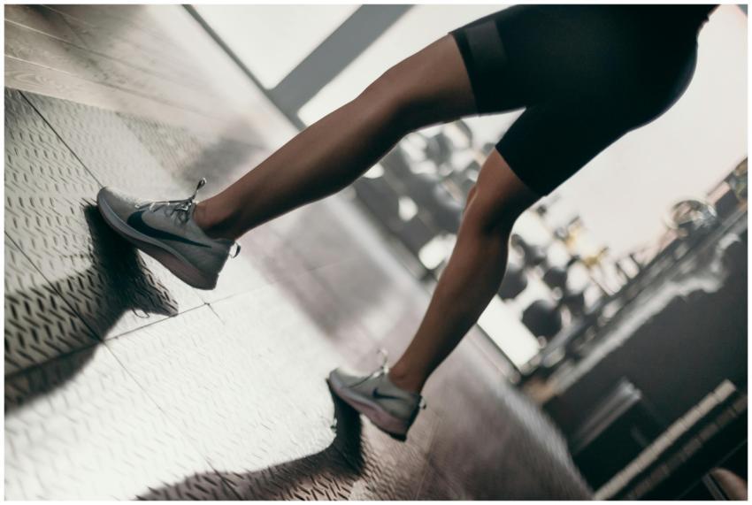 Close-up of a woman's legs in sportswear and shoes