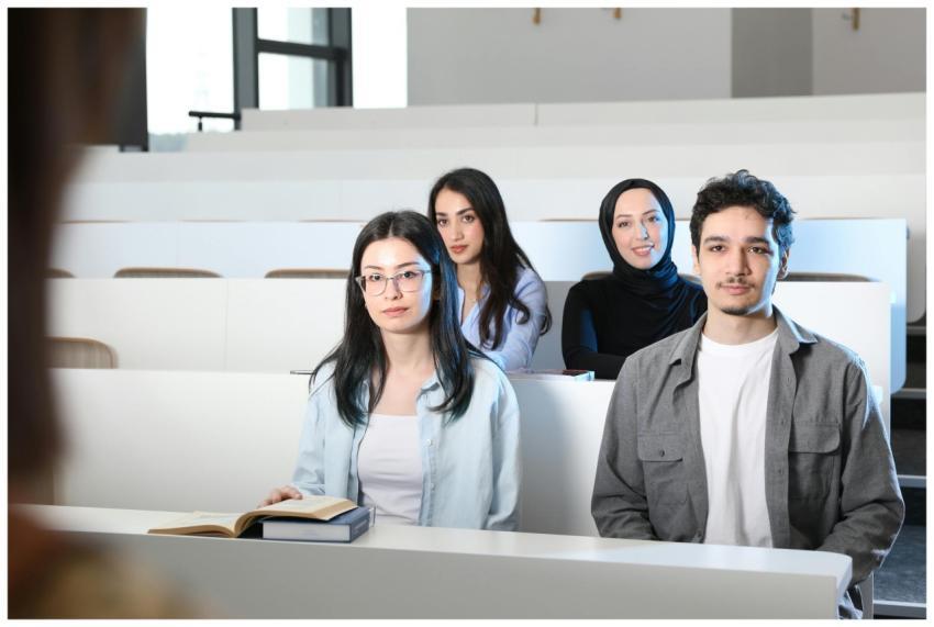 Group of diverse university students attending a c