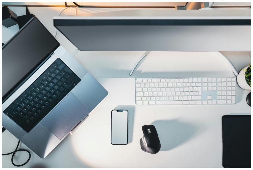 Clean and organized modern workspace featuring lap