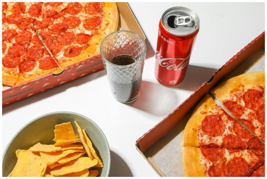 A tempting spread featuring pepperoni pizza, chips