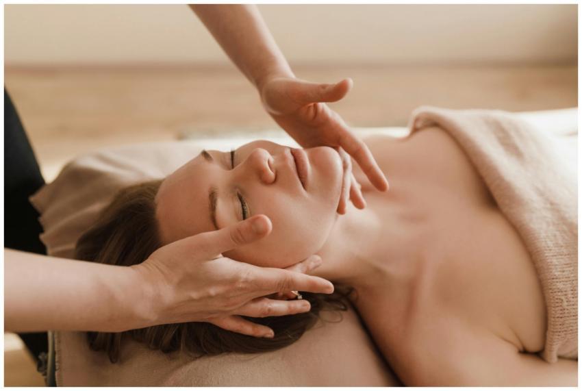 Woman receiving a soothing facial massage, promoti