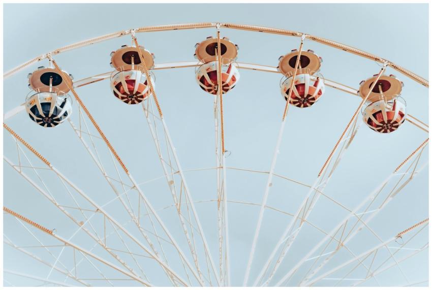 A minimalist view of a Ferris wheel with colorful