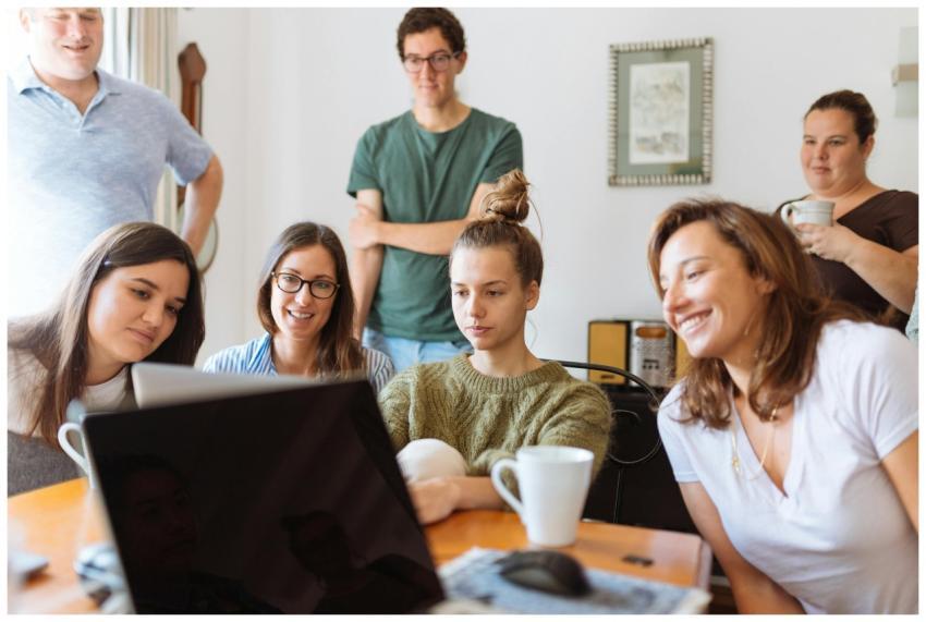 A diverse group of adults at work, enjoying a casu