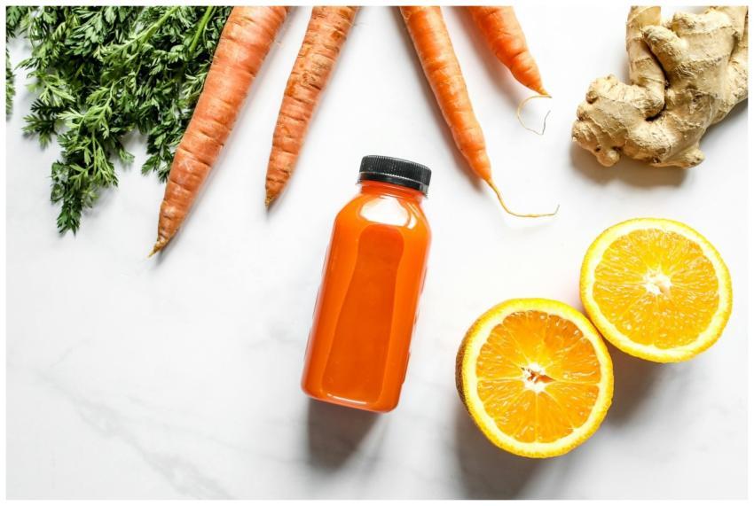 Vibrant carrot and orange juice with ginger, perfe