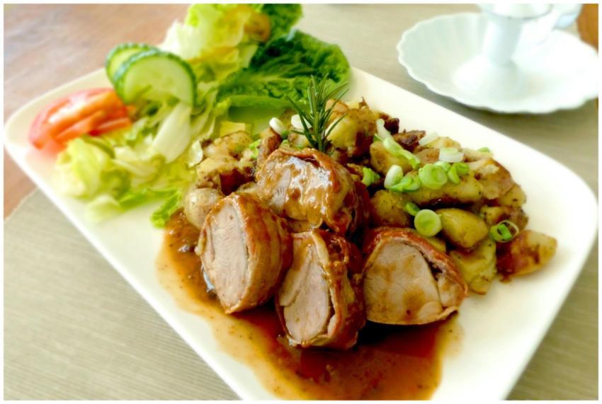 Delicious pork tenderloin garnished with rosemary,