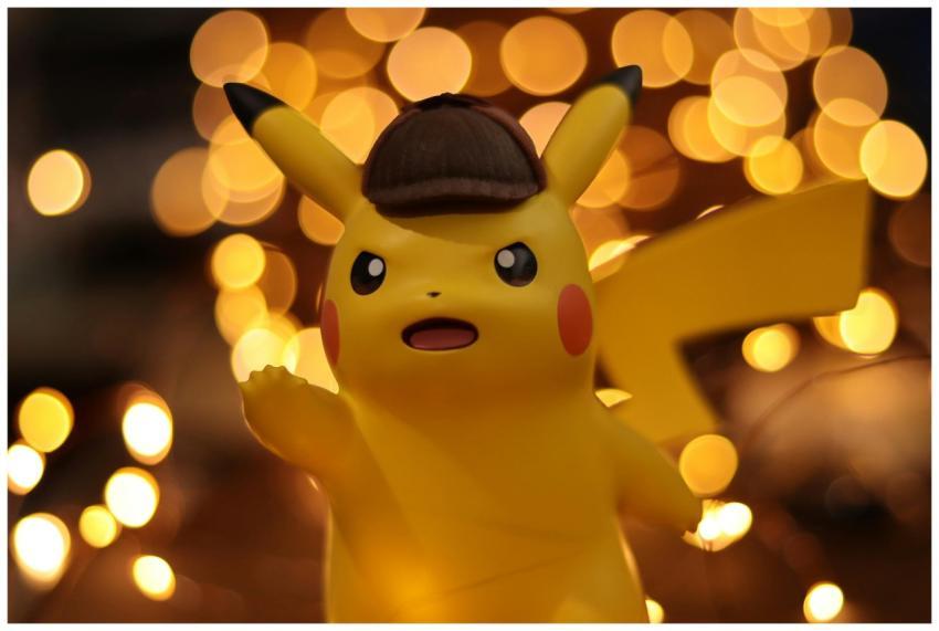 A close-up of a Pikachu figurine illuminated by a