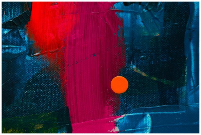 Dynamic close-up of a colorful abstract acrylic pa