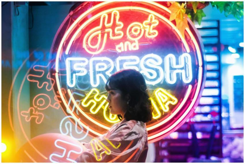 A captivating side profile of a woman against a br