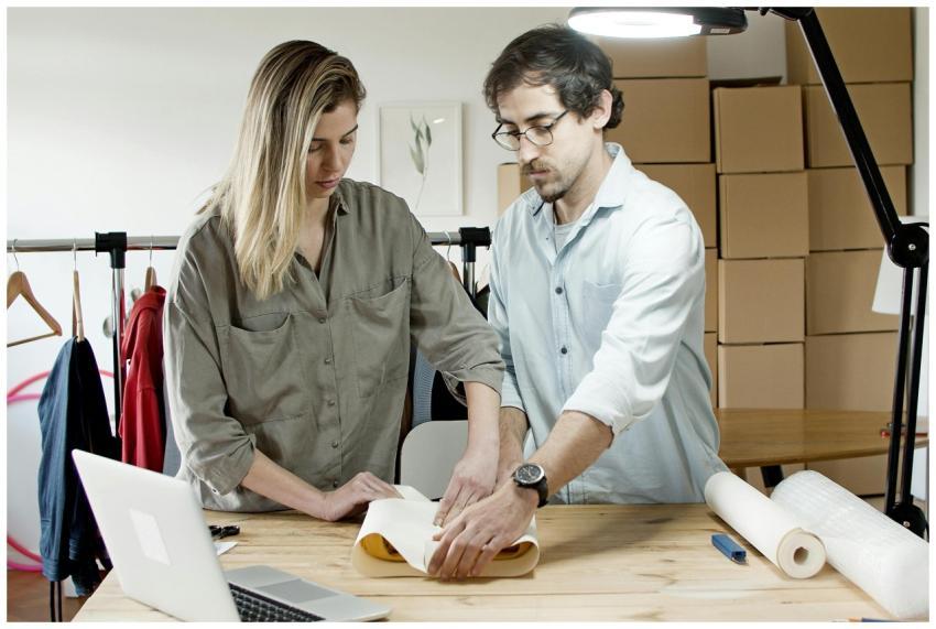 Team members packing orders in an online store's w
