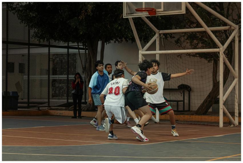 Players engage in a dynamic street basketball game