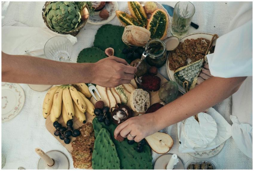 An inviting picnic setup featuring fresh fruits, b