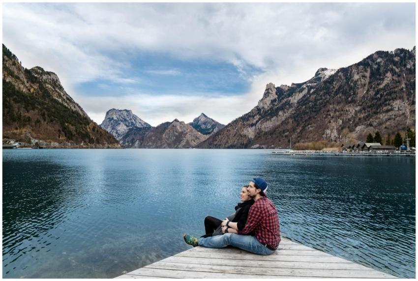 Couple enjoying a scenic view of the lake and moun