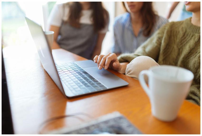 Group of women collaborating in a workspace with a