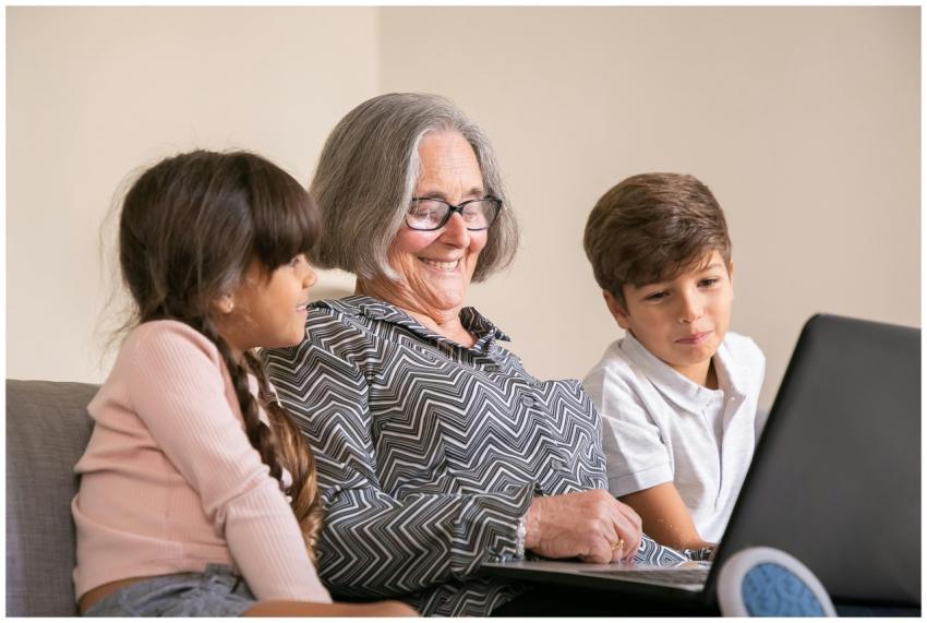 Cheerful grandmother bonding with grandchildren wh
