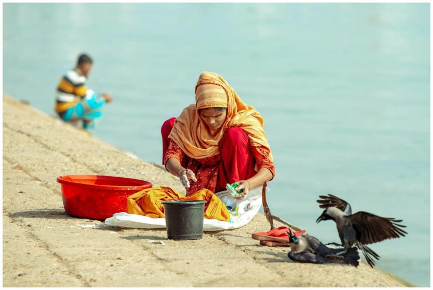 Woman Washing Clothes Riverbank