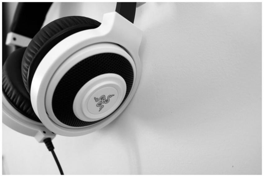 Close-up view of sleek white headphones against a
