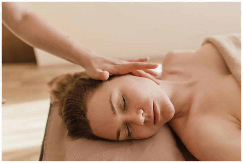 A woman receives a soothing head massage, promotin