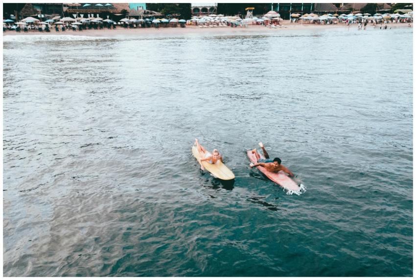 Couple enjoying a relaxing surf session in tranqui
