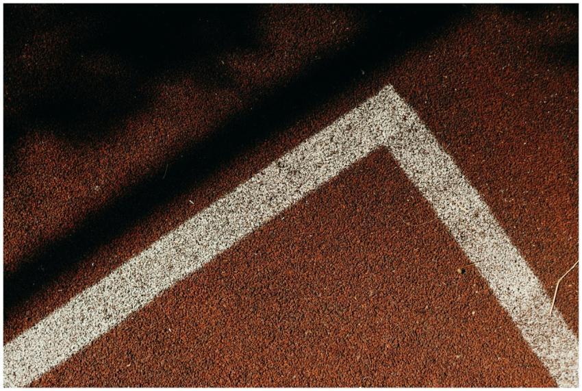 Detailed view of a white line on an outdoor tennis