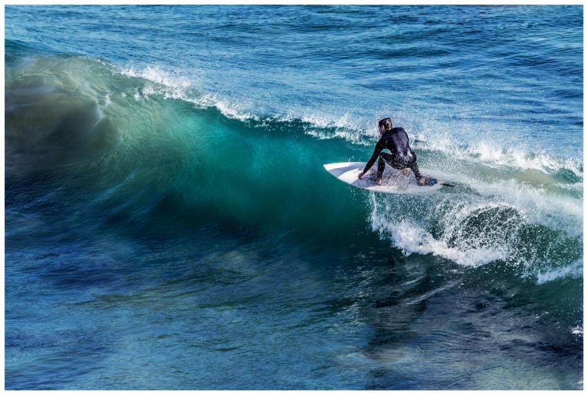 A thrilling capture of a surfer skillfully riding
